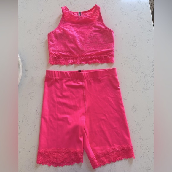 Matching highlighter pink Fenty biker short and crop top with lace